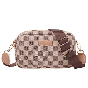 Crossbody camera bag with check pattern and adjustable wide woven strap in brown and beige