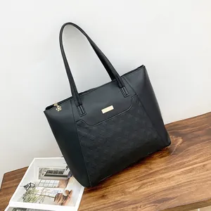 Quilted black leather tote bag with elegant gold flower zipper and metal buckle detail