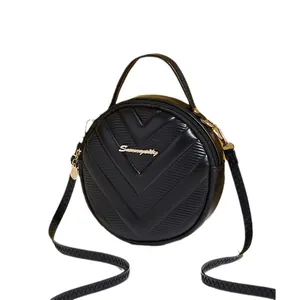 Chic black round PU leather crossbody bag with V-quilted pattern and gold hardware