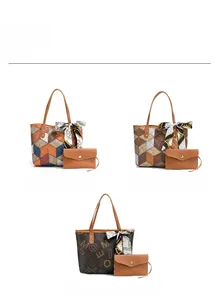 Three-piece set of printed tote bags with matching envelope pouches and silk scarves
