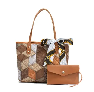 Detail of multi-color diamond pattern tote bag with matching envelope pouch and scarf