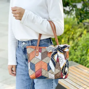 Women's geometric patchwork tote bag with colorful diamond pattern and silk scarf handle