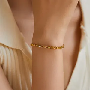 Modern 18K gold-plated brass bracelet with unique irregular geometric link chain design