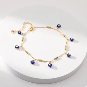 Bracelet de cheville en laiton doré 18K avec breloques œil bleu et fermoir mousqueton