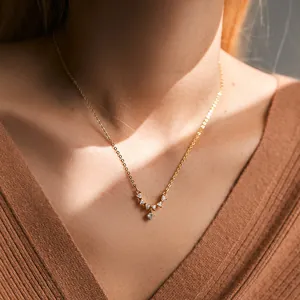 Detailed close-up of 18K gold plated Christmas tree pendant necklace with inlaid zircons