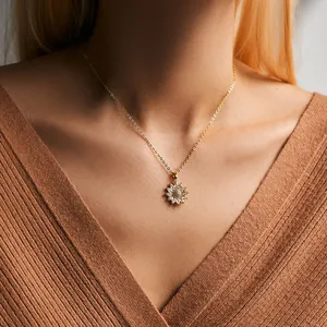 Elegant 18K gold-plated sunflower pendant necklace with zircon petals on model