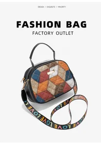 Detail of geometric color-block handbag with crocodile pattern and LOVE strap