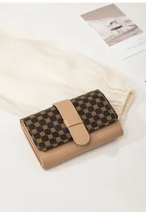 Close-up of contrast color patchwork wallet with clover pattern and textured faux leather