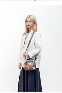 Detail of geometric patchwork crossbody bag with metal logo and LOVE letter strap