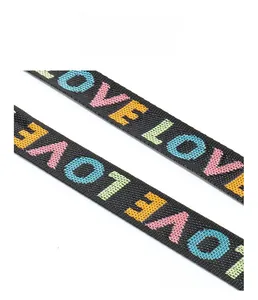 Detail of durable black woven strap with colorful LOVE embroidery and double stitching