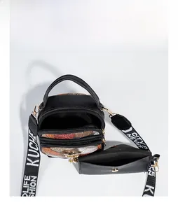 Top view of compact crossbody bag with multi-zipper compartments and detachable pouch