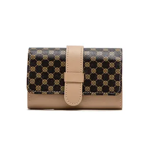 Women's compact bi-fold wallet with clover pattern and cream contrast strap buckle