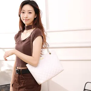 Elegant white quilted shoulder bucket bag with golden chain strap for modern women