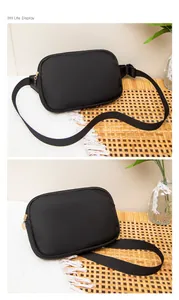 Detail der schwarzen Nylon-Brusttasche mit verstellbarem Gurt und goldenem Reißverschluss