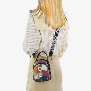 Vintage multi-color plaid crossbody bag with gold cat charm and wide logo strap