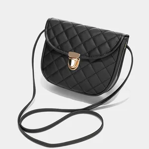 Black quilted crossbody saddle bag for women with gold clasp and elegant chain strap