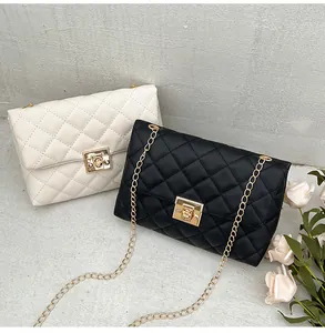 Detail of quilted chain crossbody bags in black and beige with gold metal twist locks