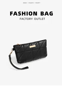 Macro shot of black triangular quilted texture on ladies clutch with gold metal zipper
