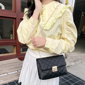 Chic black quilted crossbody bag with gold chain strap and metal swivel lock for women