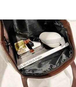 Interior view of large capacity brown monogram tote bag showing spacious storage space