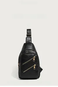 Close-up of black pebbled PU leather chest bag featuring gold-tone zippers and pockets