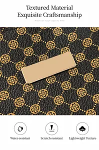 Macro shot of waterproof black leather tote with clover patterns and golden metal plate