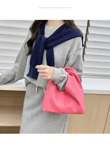 Close-up of rose pink pleated cloud bag featuring premium lychee texture leather finish