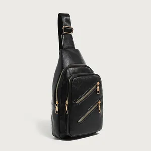Women's black PU leather crossbody sling bag with textured finish and gold zippers