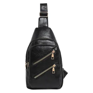 Front view of stylish black PU leather chest bag with gold zippers and adjustable strap