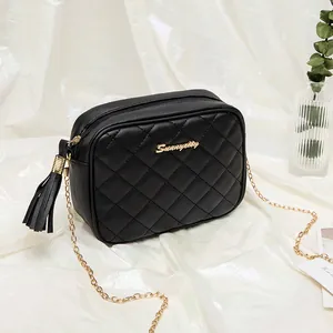 Black quilted crossbody camera bag with gold chain strap and stylish leather tassel