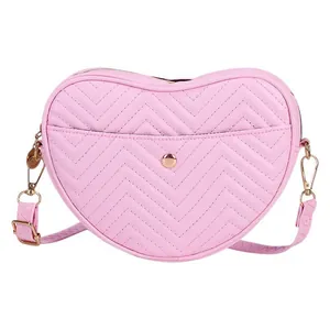 Pink heart-shaped quilted leather crossbody bag with wave embroidery and gold hardware