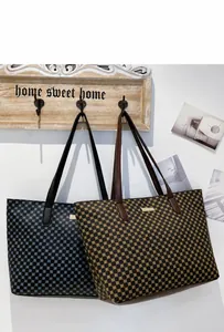 Detail view of large tote bags with geometric circle patterns hanging on wooden wall hooks