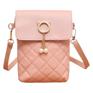 Pink quilted crossbody phone bag with gold cat ear metal ring and pearl charms