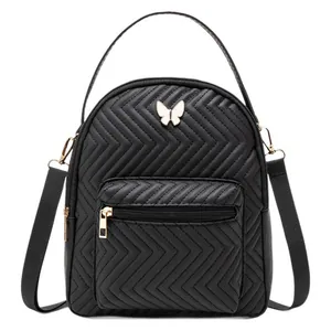 Quilted mini black backpack with butterfly metal logo and adjustable straps for daily use