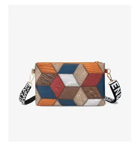 Detailed view of the geometric 3D puzzle bag showing various leather textures and metal zipper