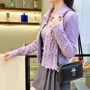 Purple wave-edge knit cardigan paired with a black crossbody bag featuring flamingo logo
