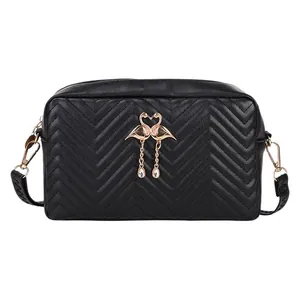 Quilted black PU leather crossbody bag with golden flamingo motif and rhinestone charms
