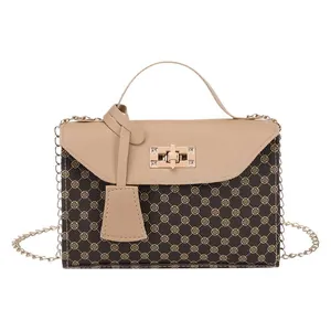 Elegant vintage brown printed handbag with beige handle and gold chain strap