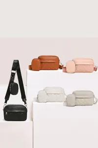 Quilted crossbody bag set featuring a detachable mini coin purse and wide fabric strap