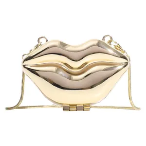 Lip-shaped champagne gold evening bag with glossy metallic finish and sleek chain strap