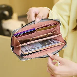 Chic grey long zipper wallet with multiple card slots and pink interior lining