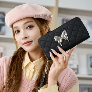 Quilted black long wallet for women with silver butterfly emblem and wrist strap