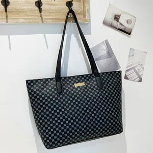 Large capacity black tote bag with blue geometric pattern and leather handles