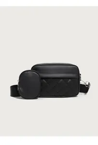 Close-up of quilted black crossbody bag with detachable mini round coin purse detail
