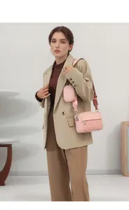 Pink quilted crossbody bag with matching mini pouch and stylish wide strap for women