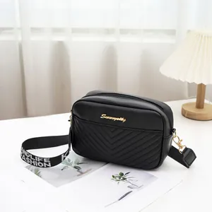 Fashionable black chevron quilted crossbody bag with stylish S-logo and wide fabric strap