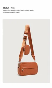 Close-up of quilted pattern crossbody bag with a round coin purse on wide fabric strap