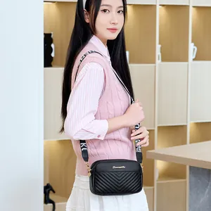 Fashionable black crossbody bag with V-quilt pattern and stylish wide shoulder strap