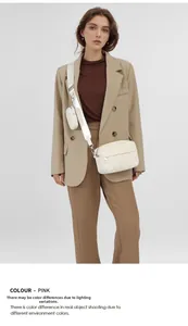 Detailed view of white quilted square crossbody bag with a detachable mini coin purse