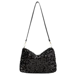 Fashionable black sequin shoulder bag with golden hardware for party and evening use